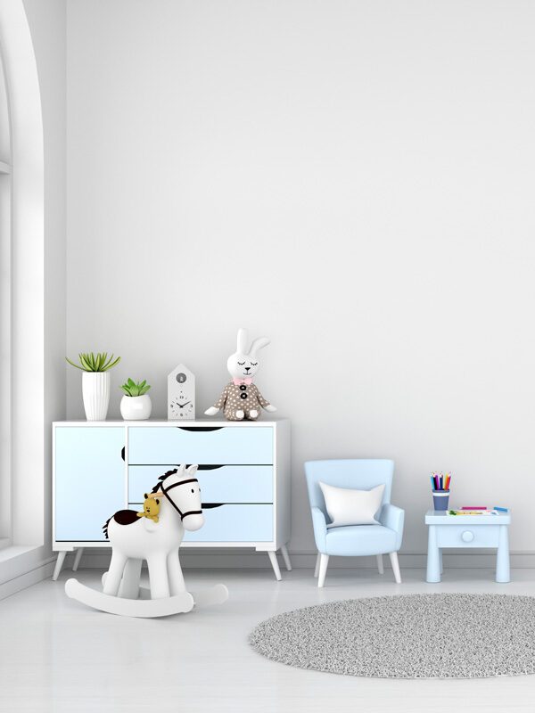 table-and-armchair-in-white-child-room-interior-with-copy-space